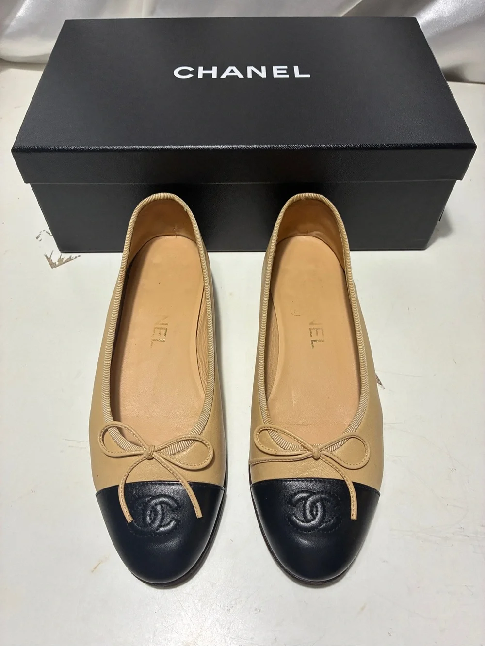 CHANEL Beige Leather Ballet Flats with Black Cap Toe